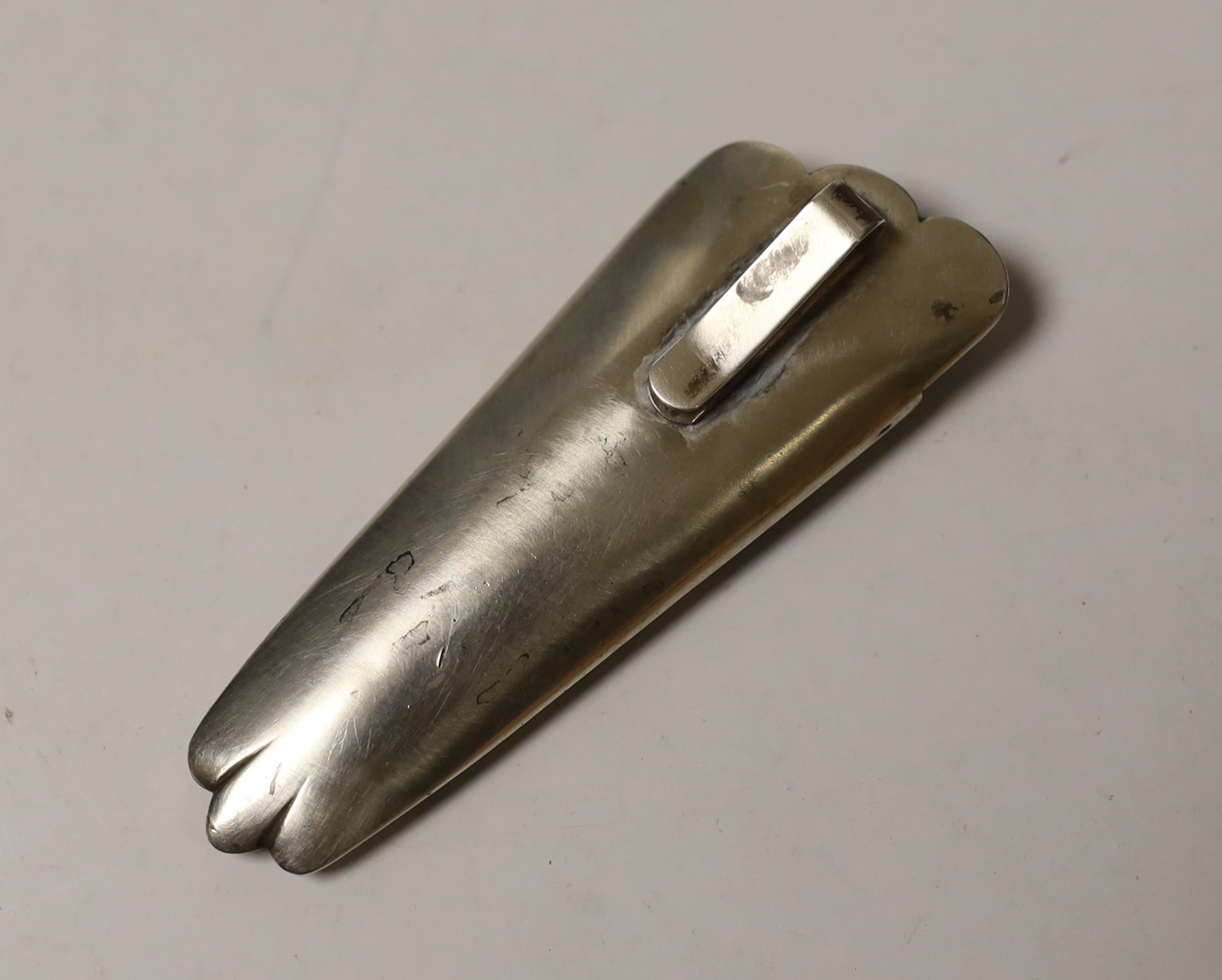 A white metal and floral enamelled posy holder, with clip verso, 85mm.